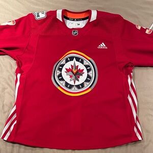Adidas NHL warm up worn Winnipeg Jets Tucker Poolman WASAC Jersey.